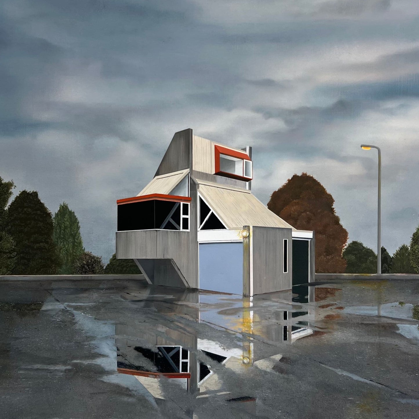 Print of a reflective wet surface with a small abandoned building structure and trees in the background