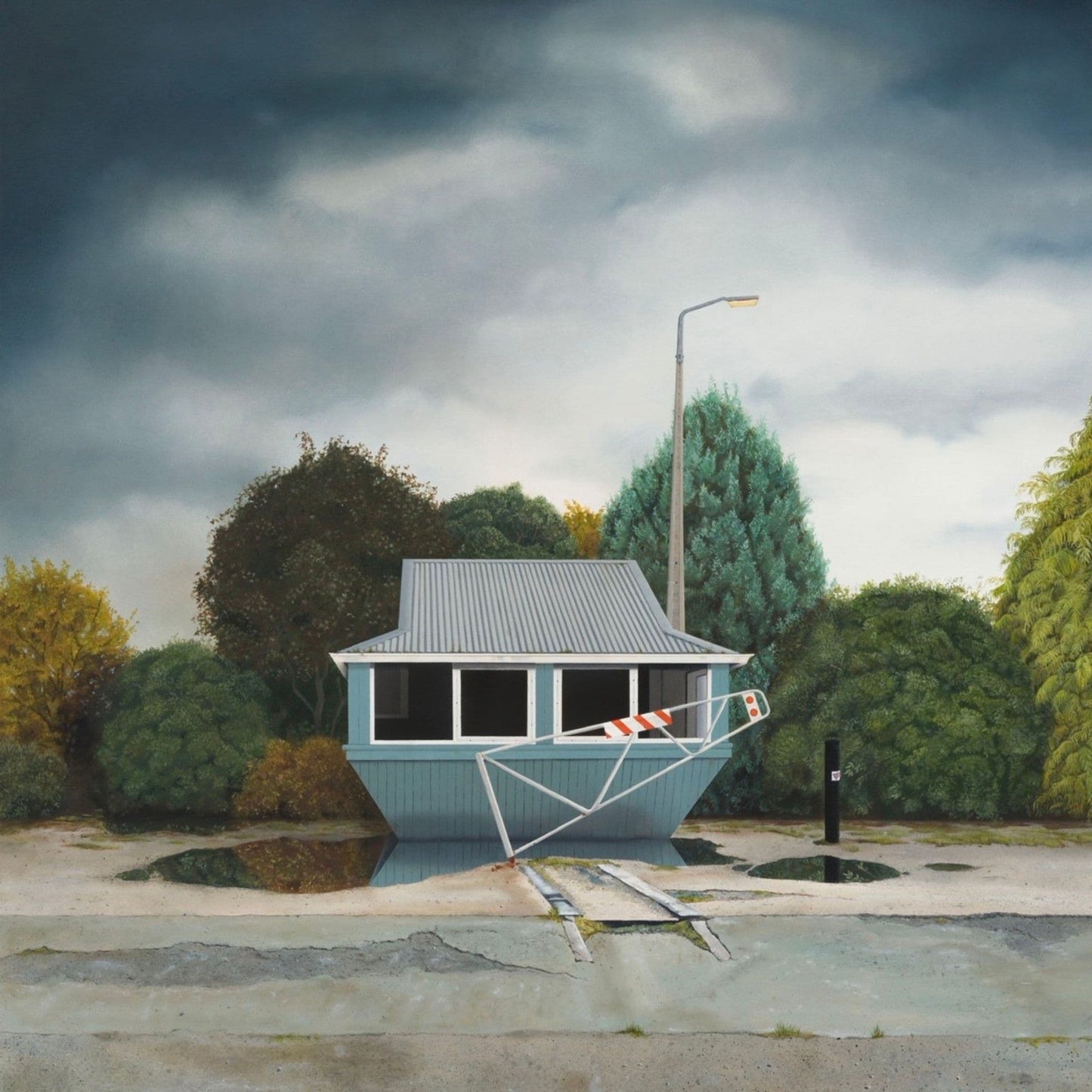 Reproduction print of a small abandoned building in a park-like setting with trees and a cloudy sky.