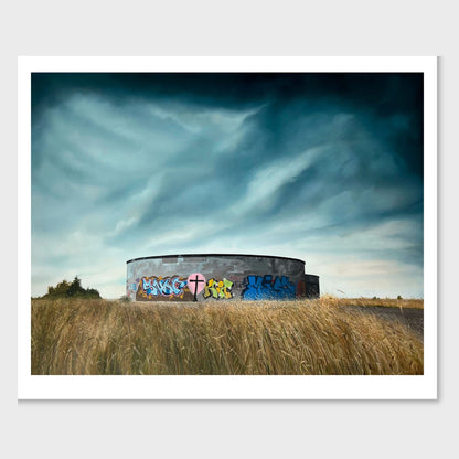Artwork by Zoe Marsden of a round concrete building with graffiti in a field under a dramatic sky
