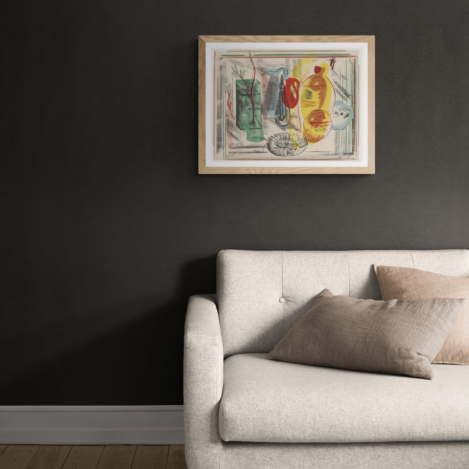 Framed print of a still life arrangement of jugs, vases and vessels in jewel like colours, hanging above cream couch.