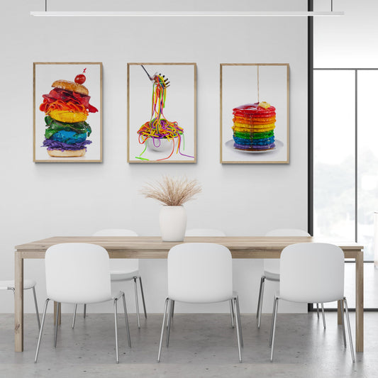 Three rainbow coloured food prints hanging in dining room