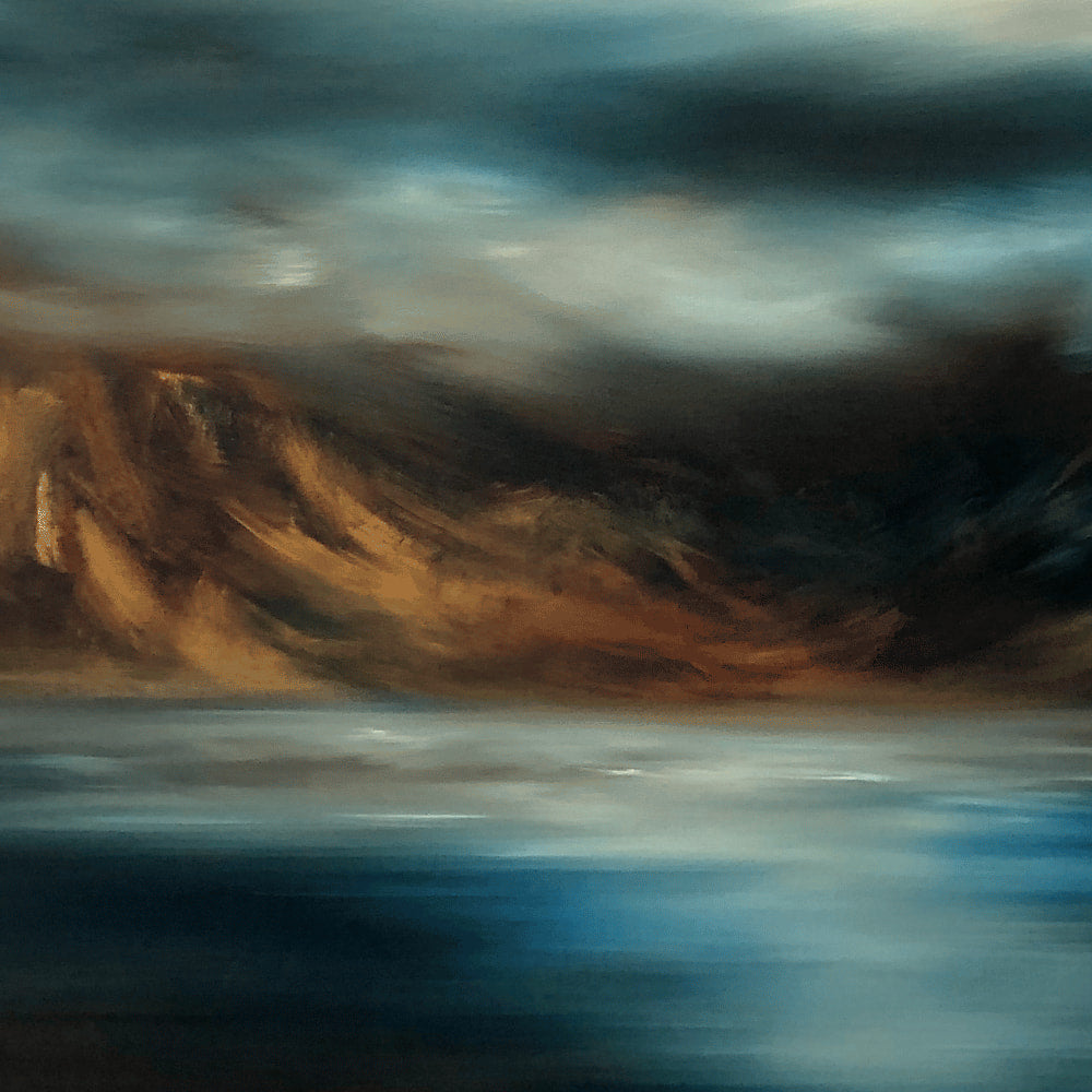 Closeup of landscape print of sea, mountains and sky in moody blues and browns. 