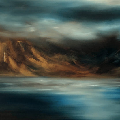 Closeup of landscape print of sea, mountains and sky in moody blues and browns. 