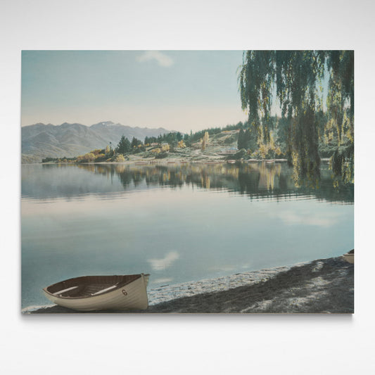 Print of a calm Lake Wanaka in 1954 with a dinghy on the beach in the bay.